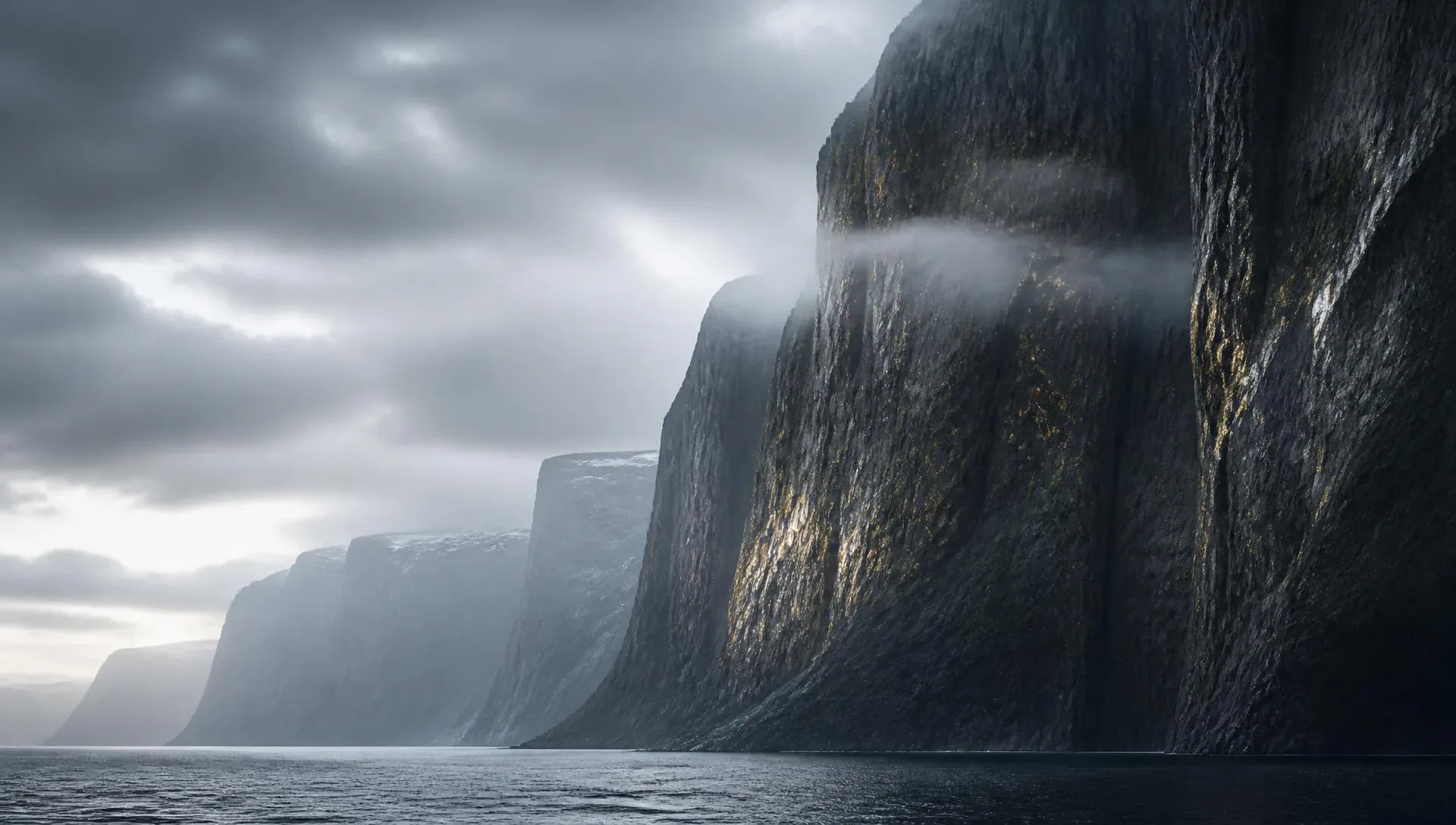 Dark Nordic cliffs rising over a misty fjord